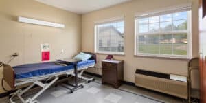 Patients room with a window at Sullivan Park Care Center